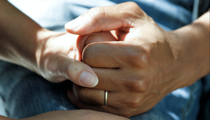 Supportive hand holding crop-1