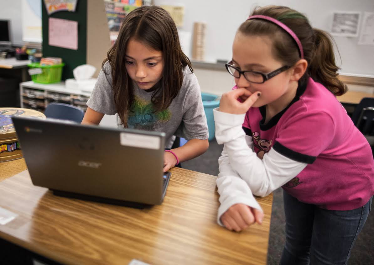 google-education-girls-devices